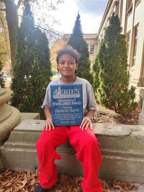 DaVinchi Harris, Strong Vincent's Stairclimber for November, poses with his plaque.